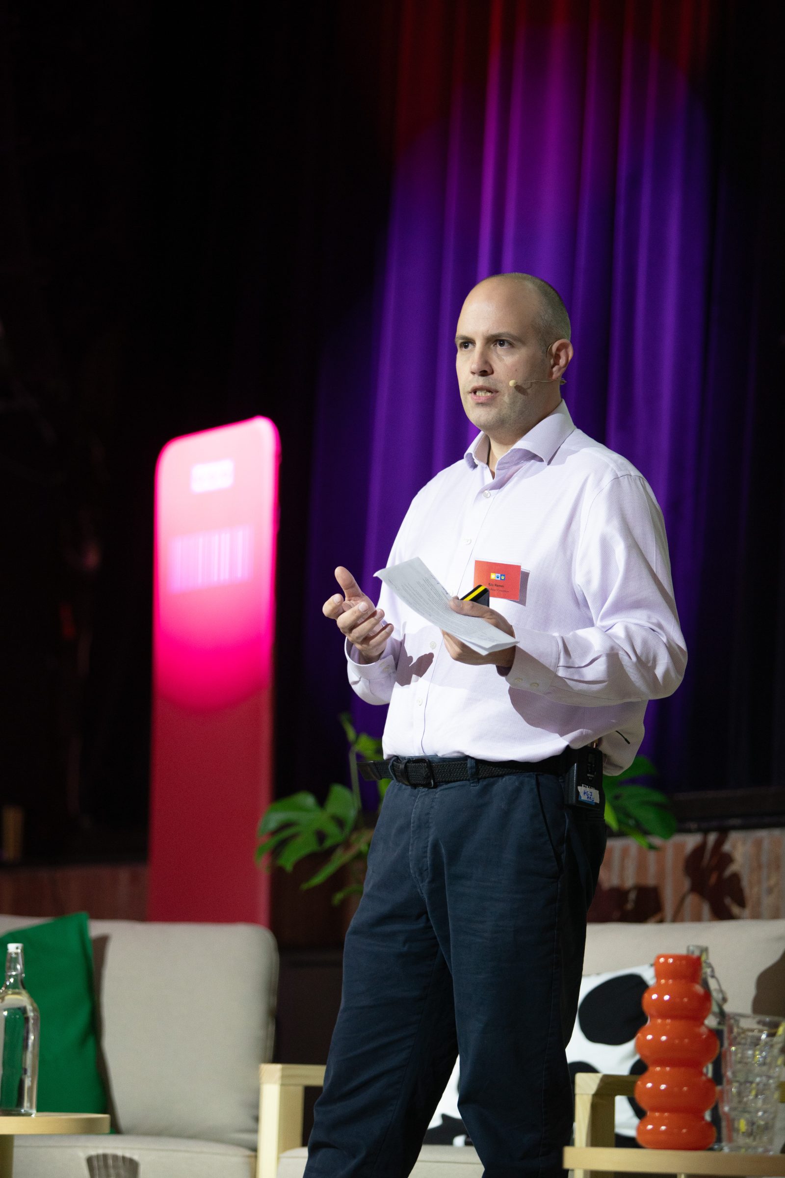 Dr Kris Hamer speaking on stage